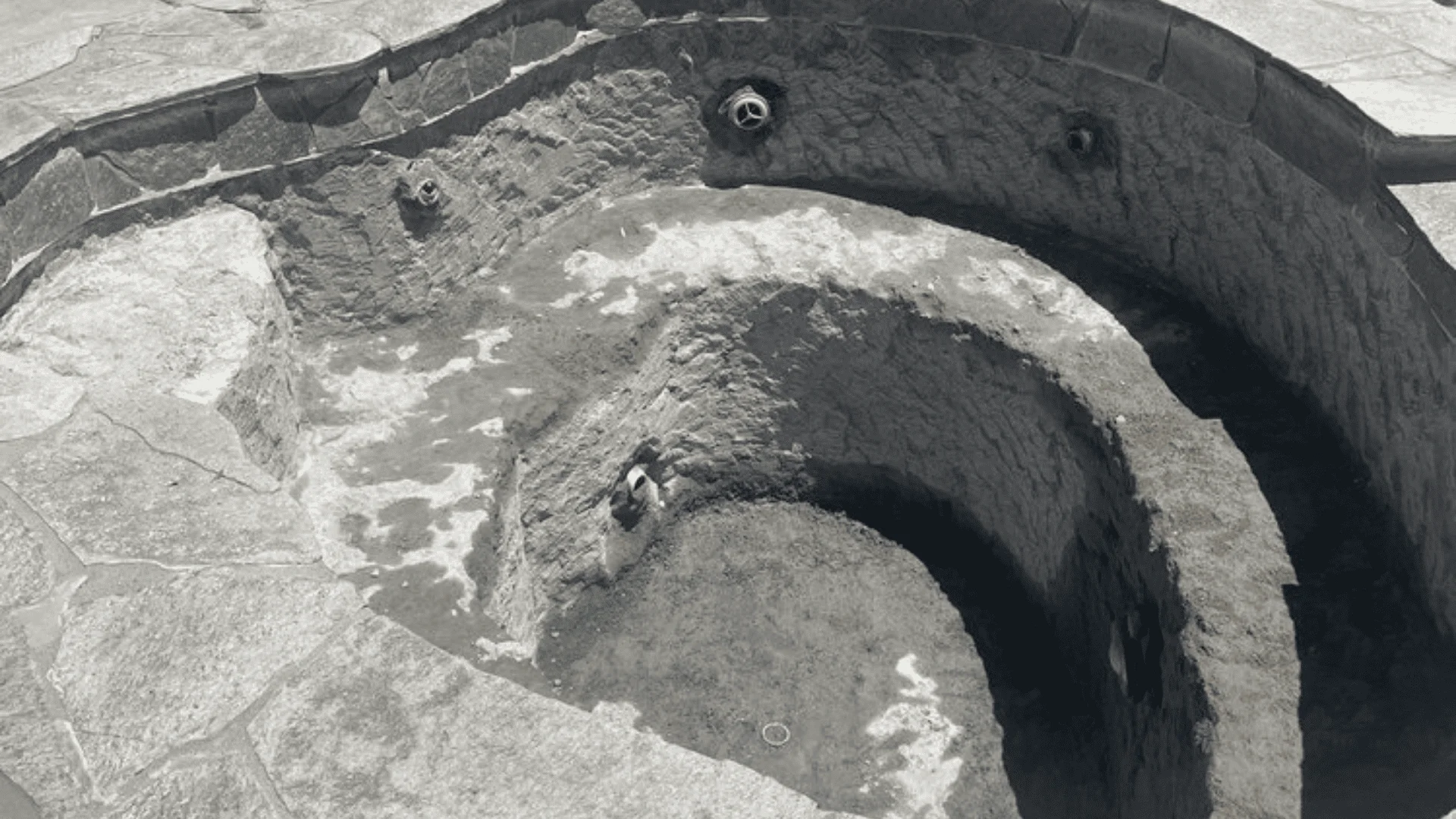 A newly constructed in-ground pool with shotcrete shell and finished decking in a residential Rialto, CA backyard. The pool features clean waterline tile and a surrounding concrete deck ready for outdoor use.